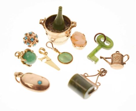 Assorted charms including a 9ct gold Champagne bucket, 9ct gold kidney bean set turquoise, handsaw stamped '14K', cameo stamp