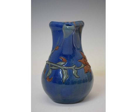 Elton Ware (Clevedon) pottery jug, ovoid form with shaped flared neck, decorated with flowering foliage on a streaked blue, b