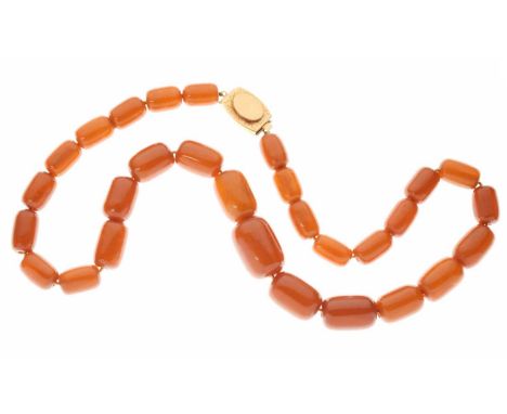 String of graduated amber-coloured bakelite beads, the twenty nine beads 11mm to 18mm, with yellow metal (750) clasp, 44.5cm 