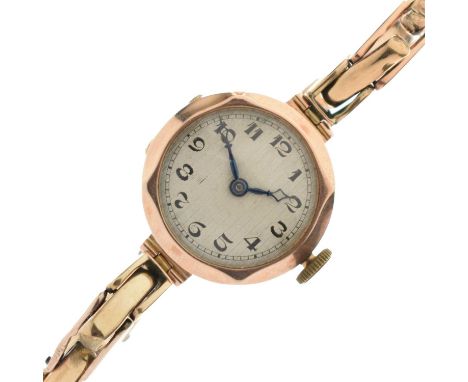 Tavannes Watch Co. - Lady's early 20th century 9ct gold bracelet watch, the textured silvered dial with black Arabic hour mar