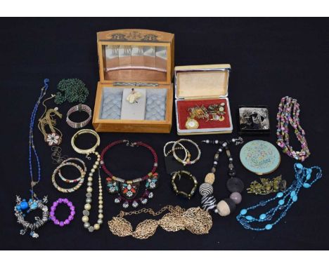 Large quantity of costume jewellery, including a musical jewellery box, necklaces, bangles, cufflinks, etc