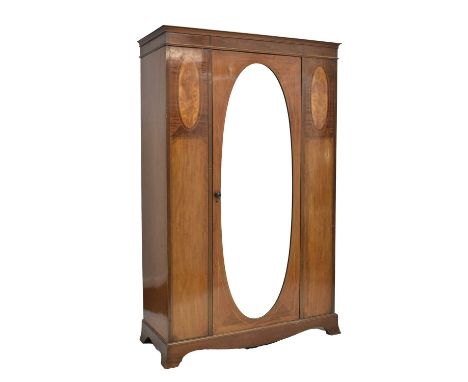 Early 20th century inlaid mahogany single wardrobe, the door fitted with bevelled edge oval mirror plate, 125cm x 53cm x 201c