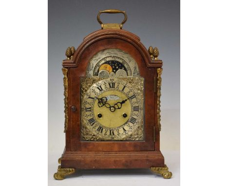 Reproduction walnut cased bracket clock, 'John Taylor, London', the engraved silvered break-arch dial with Roman hour markers