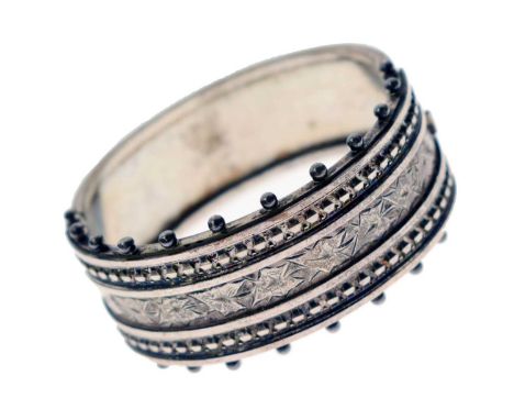 Victorian hinged bangle, having engraved ivy leaf decoration and granulation border, unmarked, 22mm wide approx, 38.1g approx