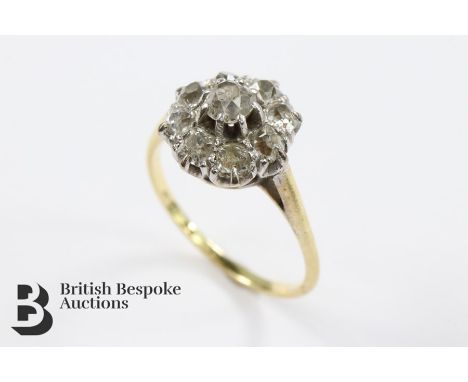 18ct yellow gold and platinum diamond cluster ring. The ring set with a center old-cut diamond approx 25 pts and surrounded b