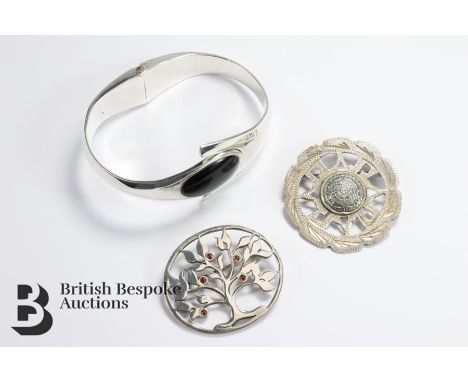 Two sterling silver brooch, together with a Mexican silver hinged bangle, approx 77.8 gms.&nbsp;