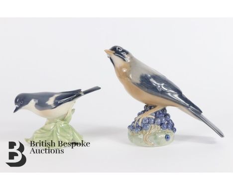 Royal Copenhagen porcelain figurines, including a Redwing seated on berries, nr 1235 , circa 1947, approx 15 cms h; together 