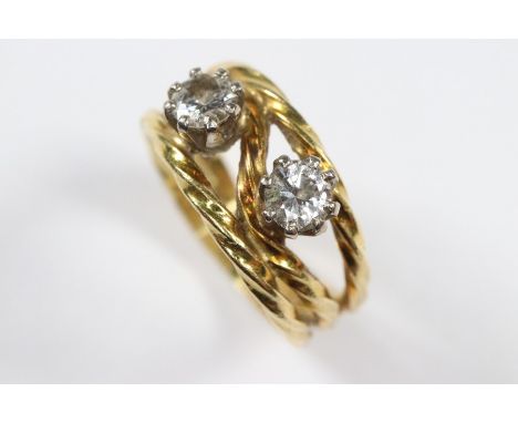 18ct yellow gold diamond ring. The wire form ring set with two diamonds approx 36 pts, size G, approx 4.29 gms.&nbsp;