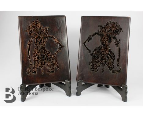 Pair of Indonesian copper plate print block, depicting dancing figures, approx 21 w x 29 h cms, supported on ebonized stands.