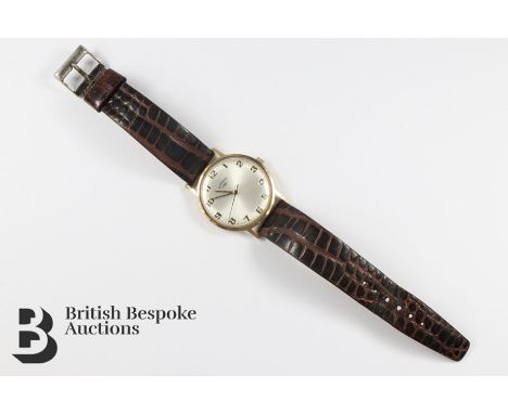 Vintage 9ct gold Rotary wrist watch. The wrist watch having a champagne face with numeric dial, on a crocodile-effect strap, 
