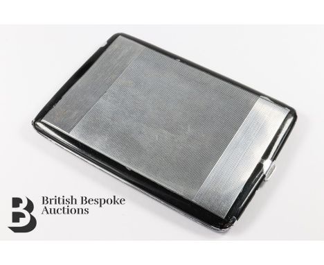 Late Art Deco chrome plated and black enamel cigarette case. The cigarette case has an interesting inscription inside which r