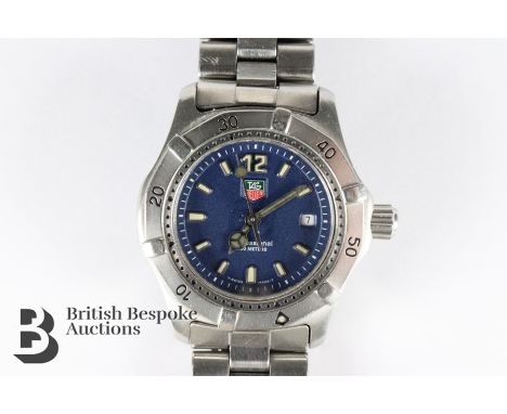 Lady's Tag Heuer Professional wrist watch. The watch having blue face with luminous numeric and baton dial, date aperture, sc