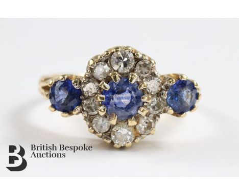 18ct yellow gold cornflower blue sapphire and diamond ring. The ring set with a central sapphire approx 4 mm diameter, the ou