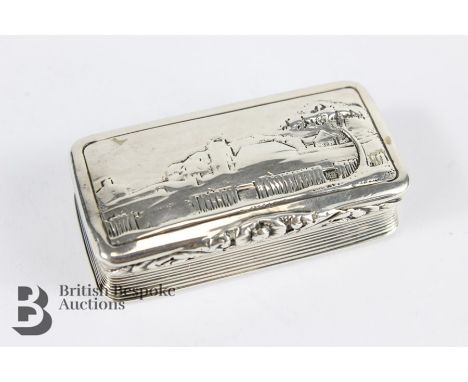 Georgian silver snuff box, Birmingham hallmark, dated 1824, mm John Harris, the top embossed with a village with an engine-tu