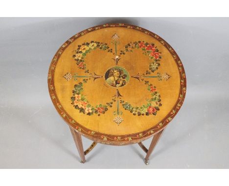 Mahogany hand painted circular table. The table having four legs with galleried stretchers, hand painted with garland, flower