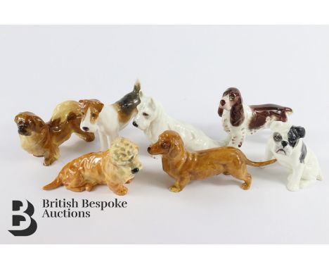 Seven Royal Worcester dogs; including a Pekinese (standing) nr 2941, Spaniel (standing) nr 3033, Terrier (seated) nr 2943, Da