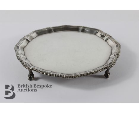 Late Victorian silver tray,&nbsp; London hallmark, dated 1897, supported on ball and claw feet, approx 17 cms diameter, mm Th