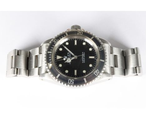 Gentleman's vintage stainless steel Rolex Submariner Oyster Perpetual wrist watch. The watch having a black face with button 