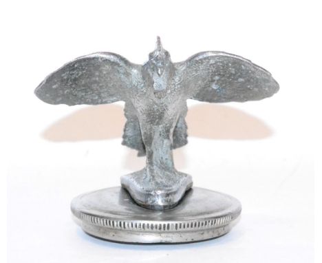 A 1930s Chrome Car Mascot from a Morris 8 as a Flying Bird, with wings outstretched, raised on a circular radiator cap, 8cm h
