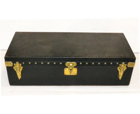 A 1920/30s Louis Vuitton Black Leather Brass Nailed Car Trunk, hinged lid, brass carrying handle and clasps enclosing fabric 