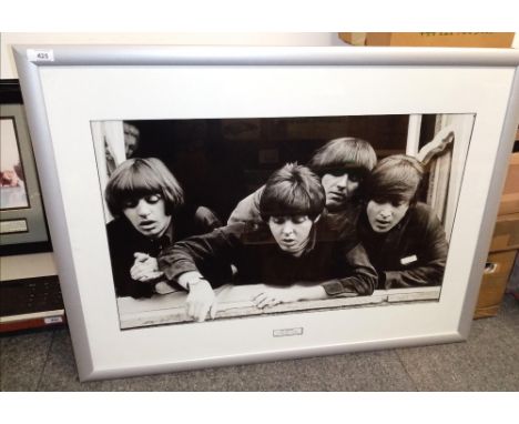 A large framed and mounted  Beatles print - measuring 86cm x 65cm ' A Hard Day's Night '