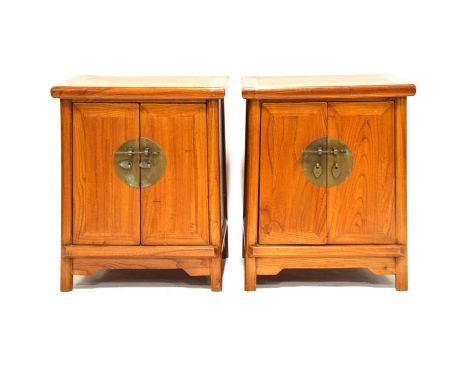 Pair of Chinese hardwood wardrobes brass locks, the interiors with shelf and drawers, width 102cm, depth 60cm, height 181cm, 