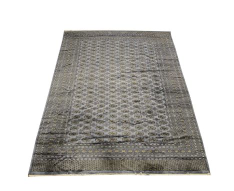 Afghan Mori Jaldar carpet, steel blue field with rows of black boteh, enclosed by multiple borders, 380x278cm.