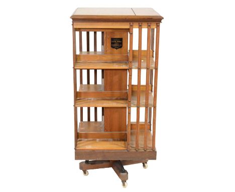 Edwardian mahogany and pine revolving bookcase, square top, vertical rails, width 60cm, height 124cm, labelled Tubner &amp; C