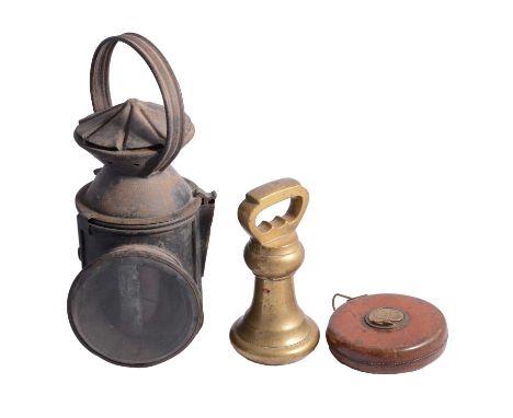 A railway lamp, hinged cover revealing blue and amber glass behind central clear circular bevelled glass, plate pierced with 