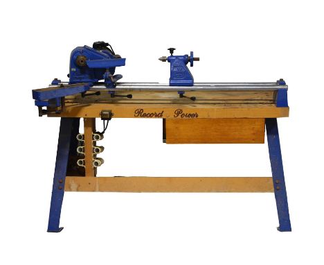 Record Coronet wood turning lathe, on a Record Power bench with some turning tools and accessories.Condition report:Single ph