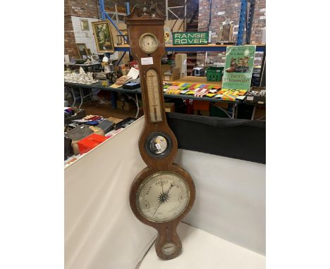 A LOVELY WOODEN CASED BAROMETER, BANJO STYLE, WITH MERCURY THERMOMETER, A SHAPED TOP AND AN ACORN FINIAL 
