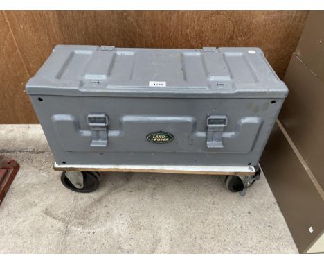 A METAL TOOLBOX AND TOOL CONTENTS WITH A LAND ROVER BADGE AND TROLLEY BASE 