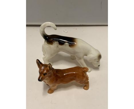 A ROYAL DOULTON CORGI DOG AND A BESWICK FOX HOUND 