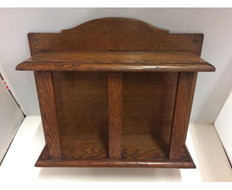 AN UNUSUAL OAK WALL SHELF 