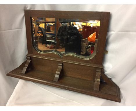A VINTAGE MAHOGANY WALL SHELF WITH A MIRROR 