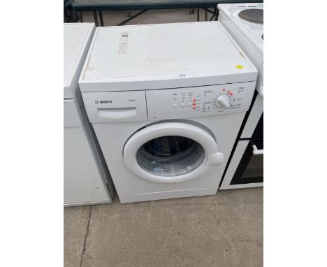 A WHITE BOSCH MAXX6 WASHING MACHINE WITH INSTRUCTION MANUAL 