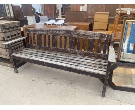A LARGE WOODEN SLATTED GARDEN BENCH 