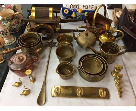 A LARGE QUANTITY OF BRASSWARE TO INCLUDEPLANTERS, COAT RACK, MICE, WOODEN HORSE CART, WATERING CAN AND A SMALL COPPER KETTLE 
