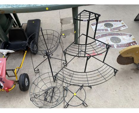 AN ASSORTMENT OF GARDEN ITEMS TO INCLUDE A WROUGHT IRON PLANT STAND, THREE TIERD PLANT STAND AND WIRE HANGING BASKETS ETC 