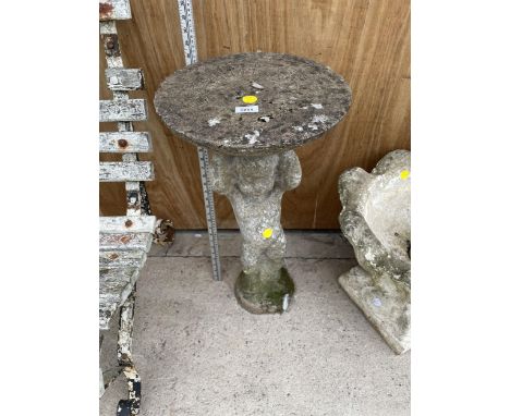 A CONCRETE SUNDIAL WITH CHERUB BASE 