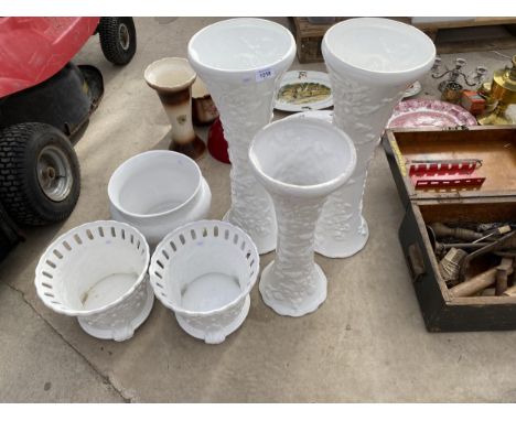 AN ASSORTMENT OF WHITE CERAMIC JARDINAIRES AND JARDINAIRE STANDS 