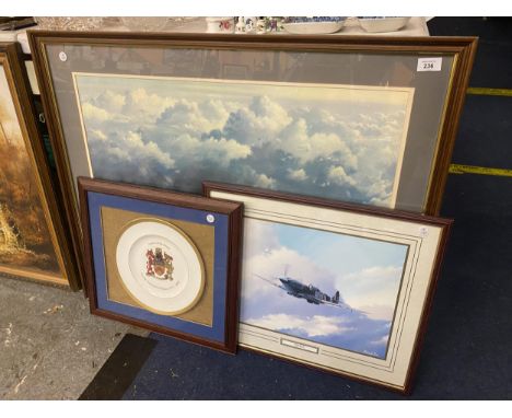 A LARGE FRAMED PICTURE OF A SPITFIRE FLYING THROUGH BROODING SKIES SIZE 91CM X 74CM SIGNED ROULSON, A FRAMED PRINT OF A SPITF