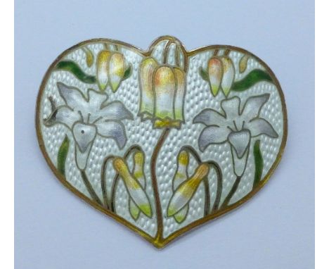 A silver and enamelled brooch, marked sterling