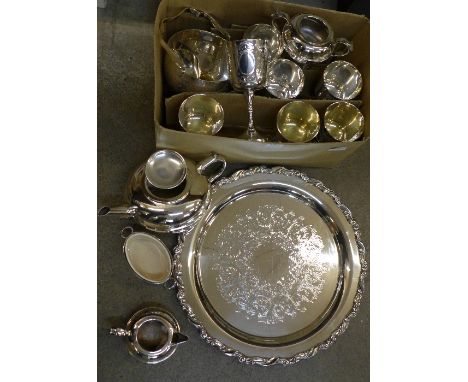 A collection of plated ware including a three piece tea service, an Oneida tray, eight goblets, an ice bucket and a Wilkinson