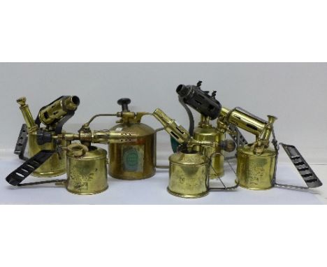 Five brass blow torches and a brass oil can, torches marked Bladon x2, Monitor No.26, Swedish soldering lamp and one other