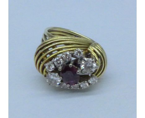 A yellow metal, ruby and diamond cluster ring, 7.8g, J