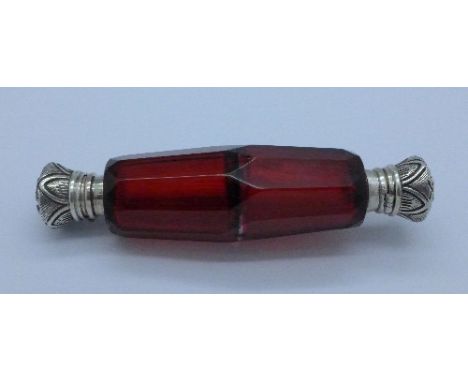 A ruby glass scent bottle, with one inner stopper