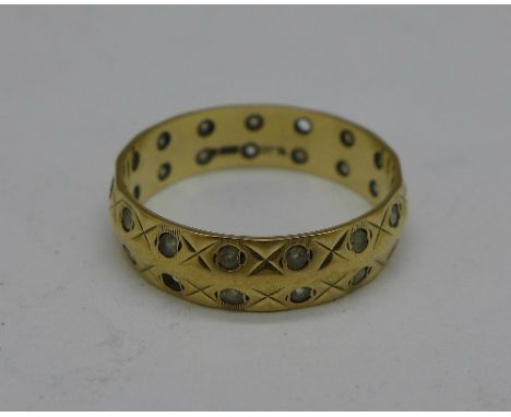 A 9ct gold ring, 2.9g, R, lacking two stones