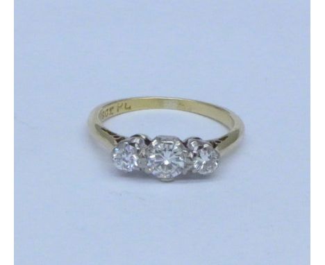 An 18ct gold and three stone diamond ring, 2.1g, K, over 0.5ct total diamond weight