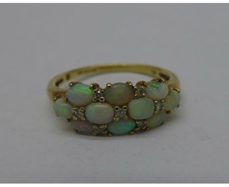 A 9ct gold and opal ring, one opal a/f, 2.6g, R